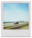 Polaroid of a car on a motorway