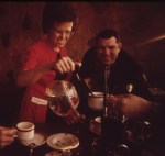 Woman serving coffee to policemen