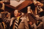 Men raising steins of beer