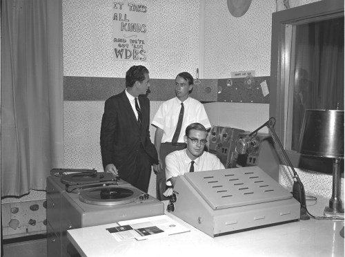 Guys spinning the hits at a radio station