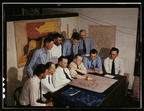 men and maps Various men surrounded my various maps