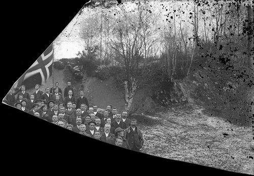 fragmented photo of men with flag