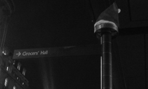 Santa hat atop a sign