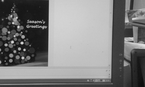 Monitor displaying Christmas card email