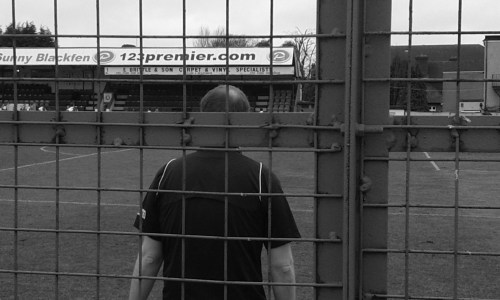 Assistant referee through a cage